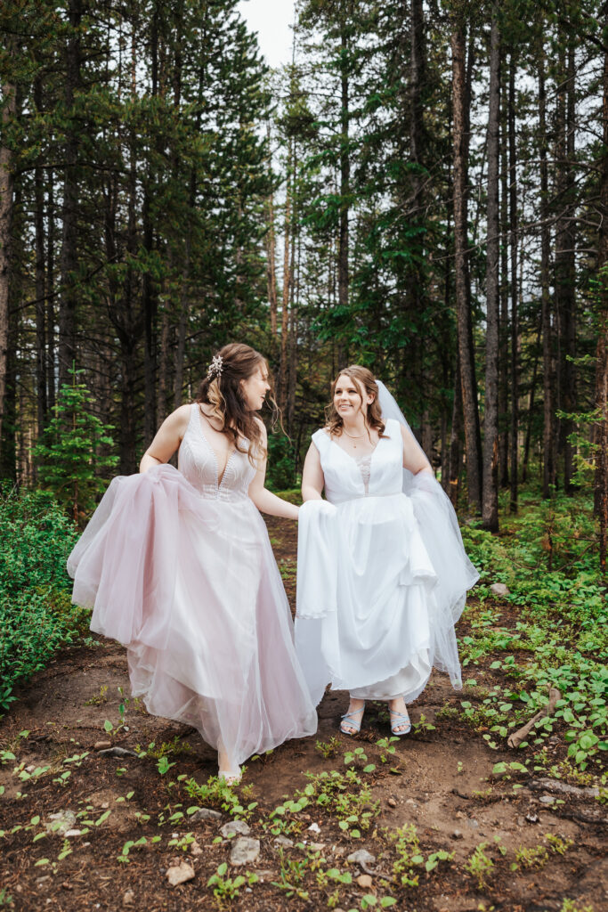 Two Brides in the forrest in Breckenridge Colorado at Ten Mile station